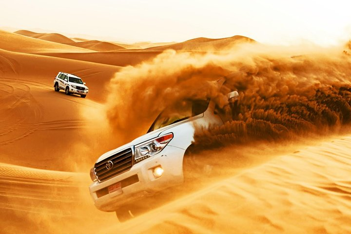 Experience the thrill of dune driving in Dubai's stunning desert landscape where the golden sands meet adrenaline-pumping adventure in an unforgettable morning escapade.